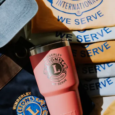 Wimberley Lions Club custom apparel, hat, and laser-engraved Yeti tumbler collection