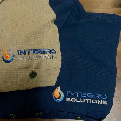Integro Solutions custom embroidered work shirts in tan and navy