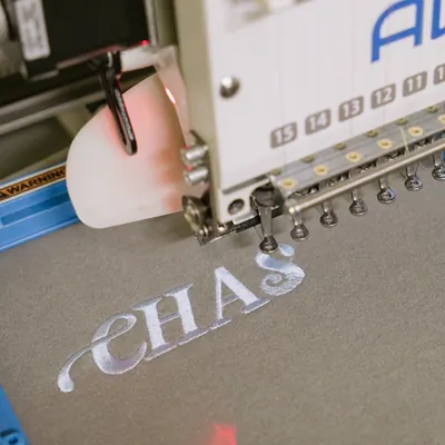 Custom monogram embroidery being stitched on the Valkyrie Made machine