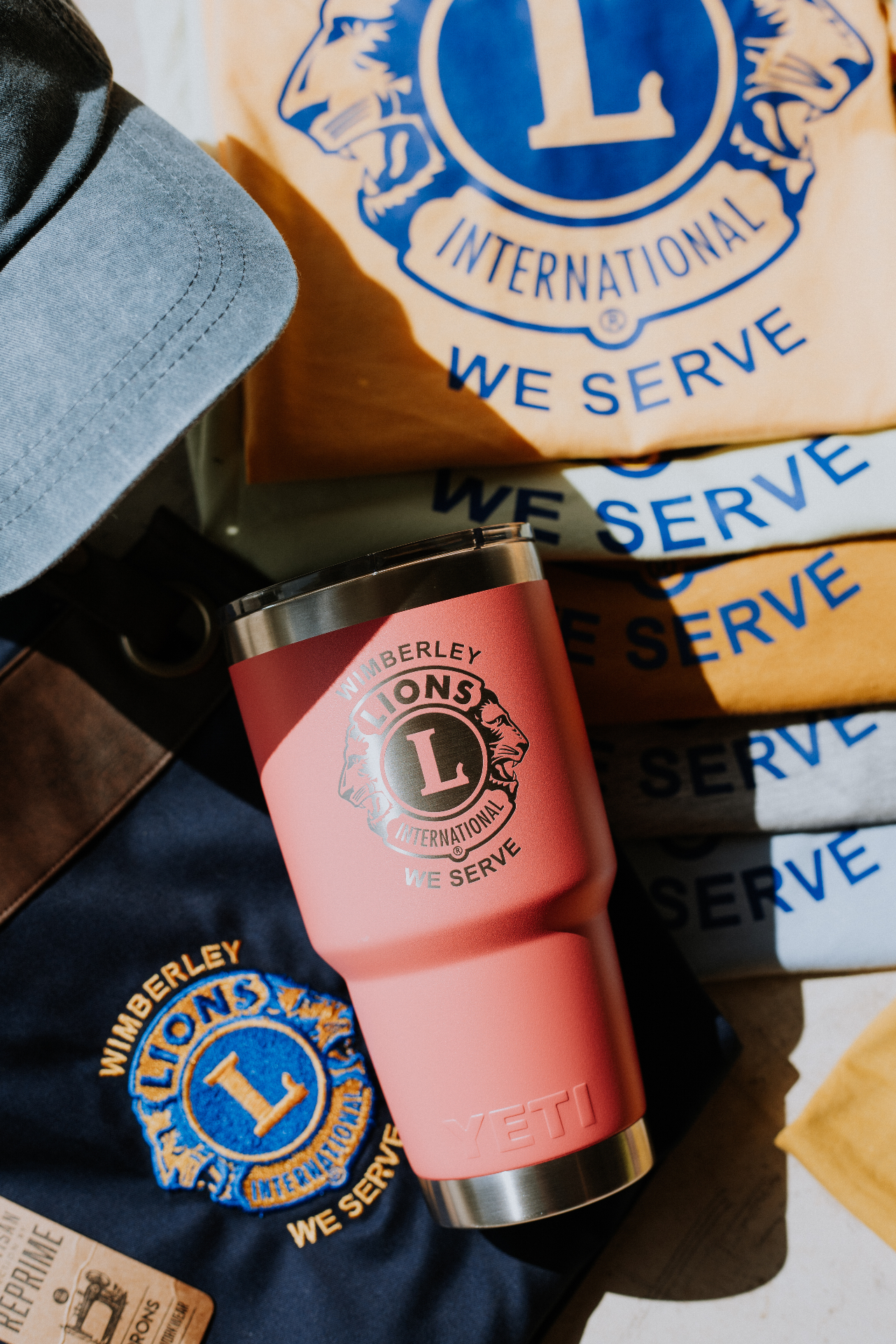 Wimberley Lions Club custom apparel, hat, and laser-engraved Yeti tumbler collection