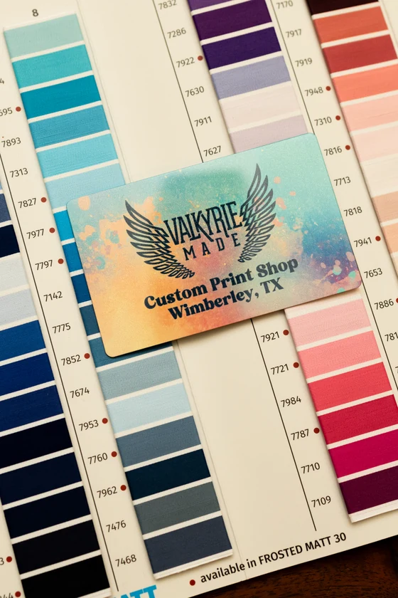 Valkyrie Made brand card resting on thread color swatches