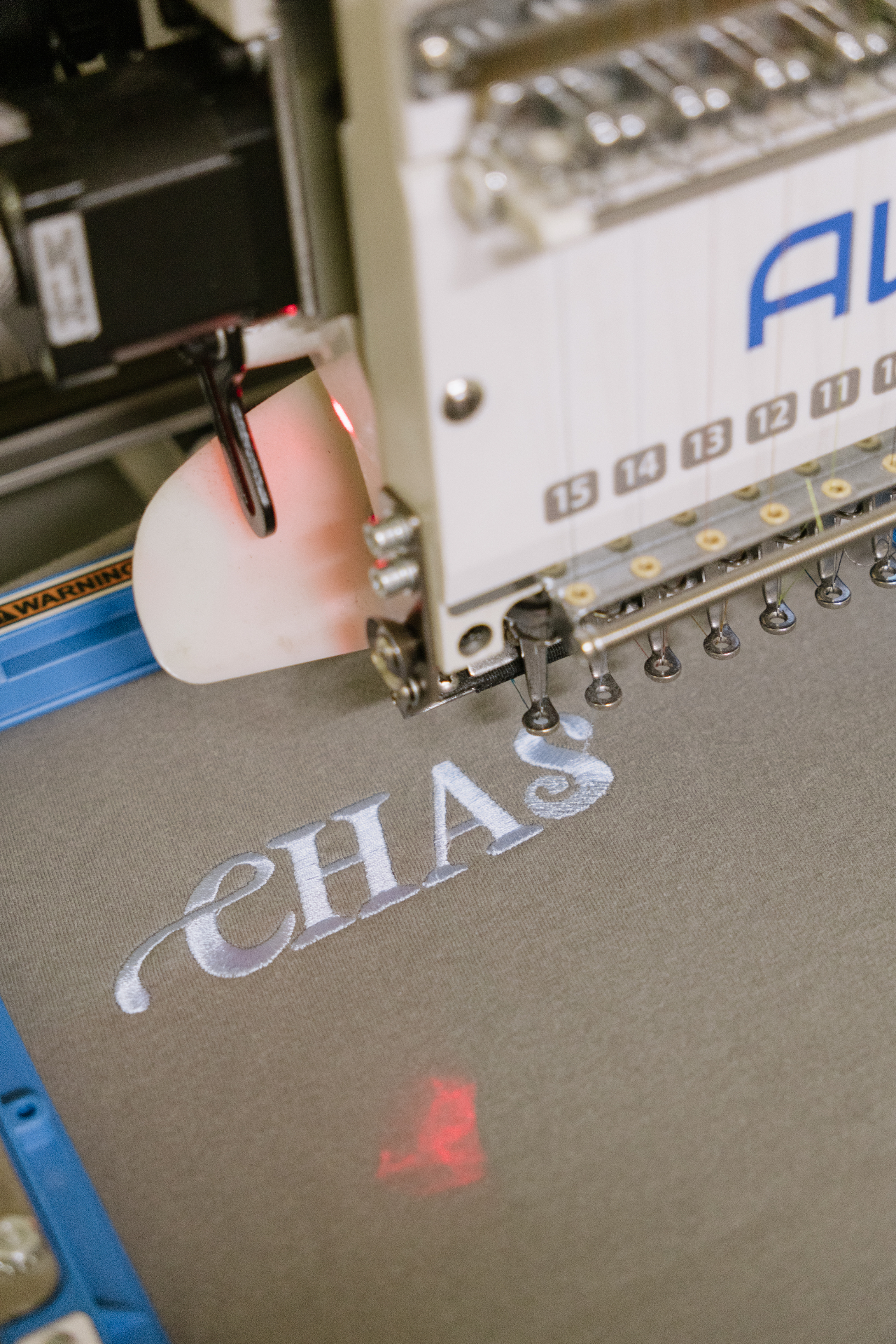 Custom monogram embroidery being stitched on the Valkyrie Made machine